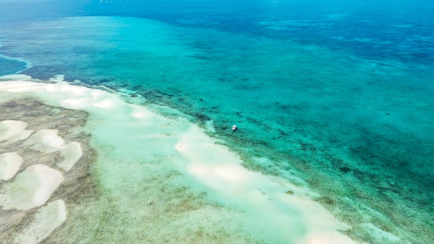 Aerial view of a beach and turquoise water in The Bahamas