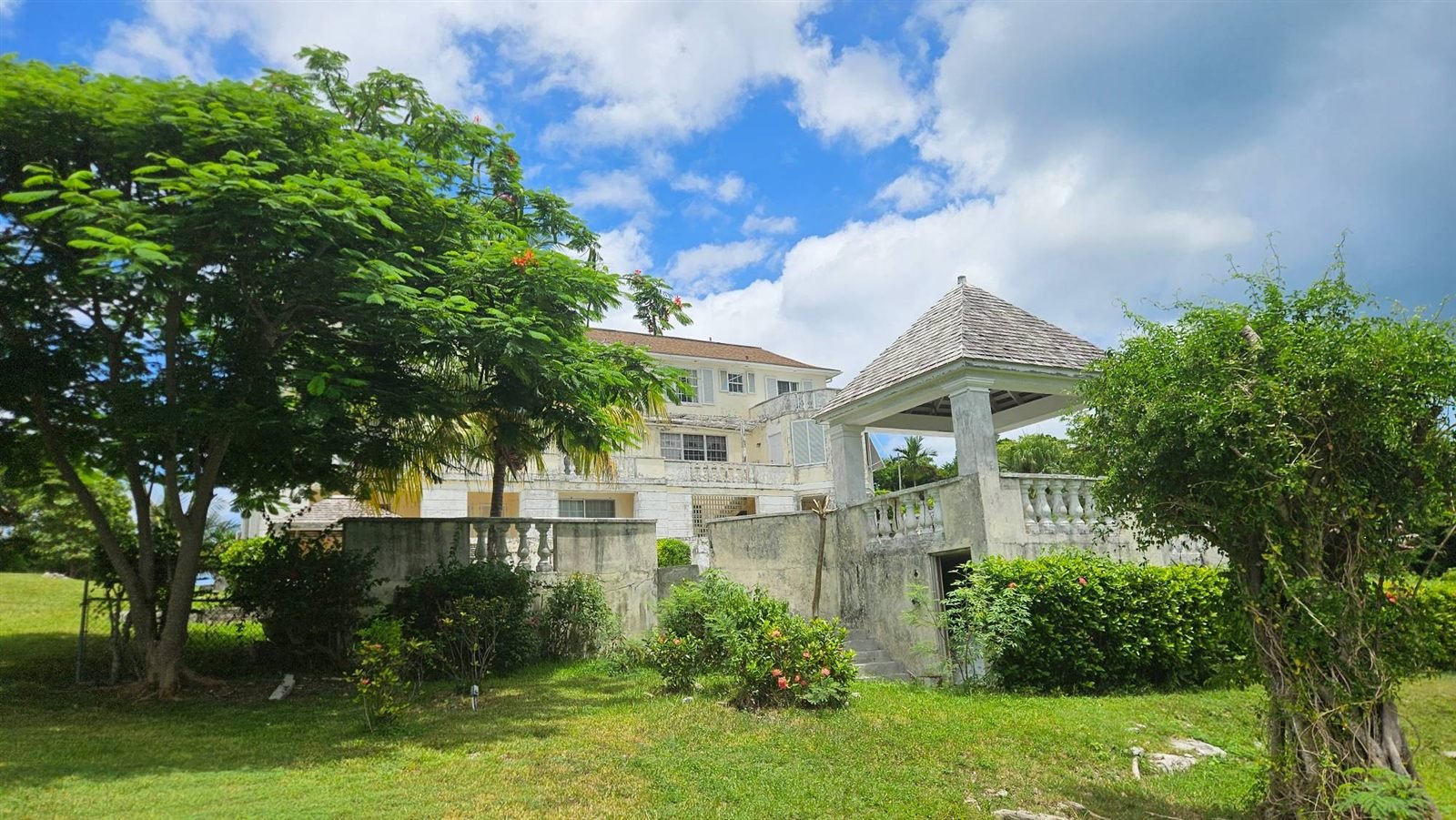 Hillside villa with a gazebo and garden